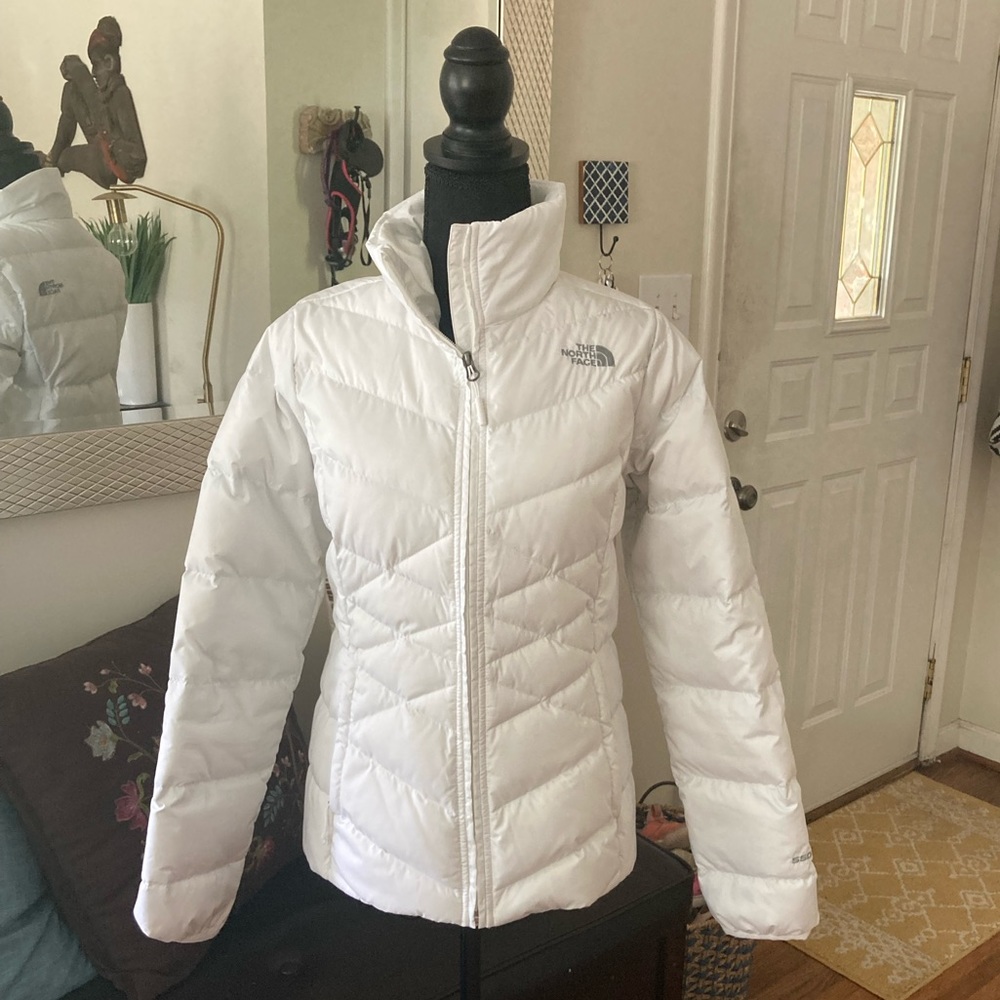 The North Face women’s white down jacket.  Only worn once!